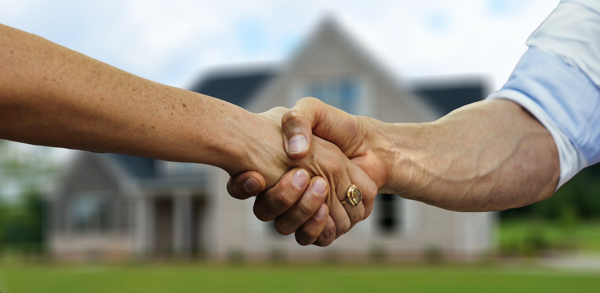 Handshake of trust between homeowner and roofing contractor